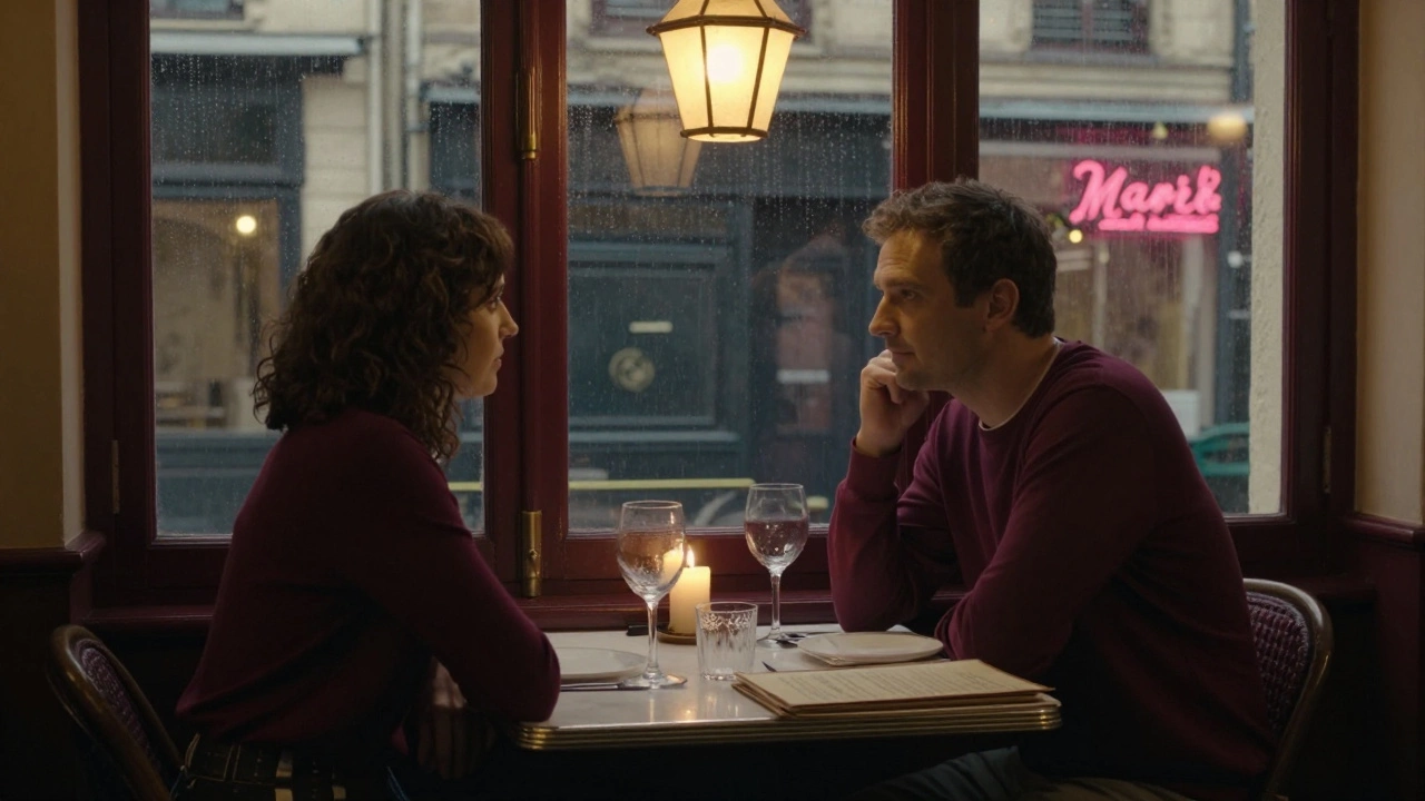 Two people share a quiet dinner in a candlelit Parisian bistro, warm light reflecting off wine glasses.